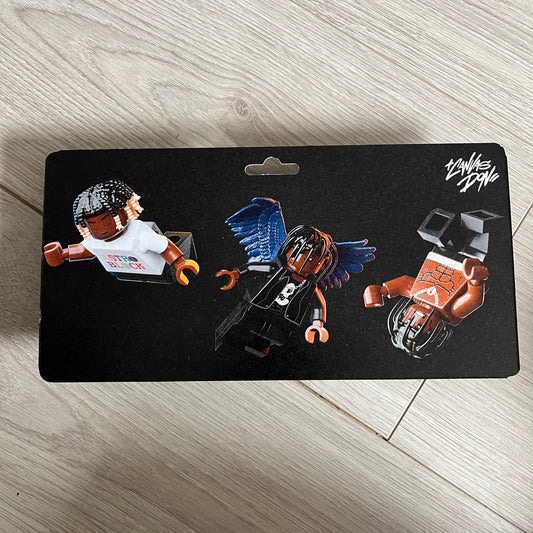 Lego Travis Scott Minifigures Triple Pack featuring three custom figures: Brick Rodeo, Bricks in the Trap, and Astroblock, each inspired and styled after Travis Scott’s iconic album eras. All three are sealed and mounted on a single display card with matching Lego album artwork, a collectible piece created by TheCanvasDon.