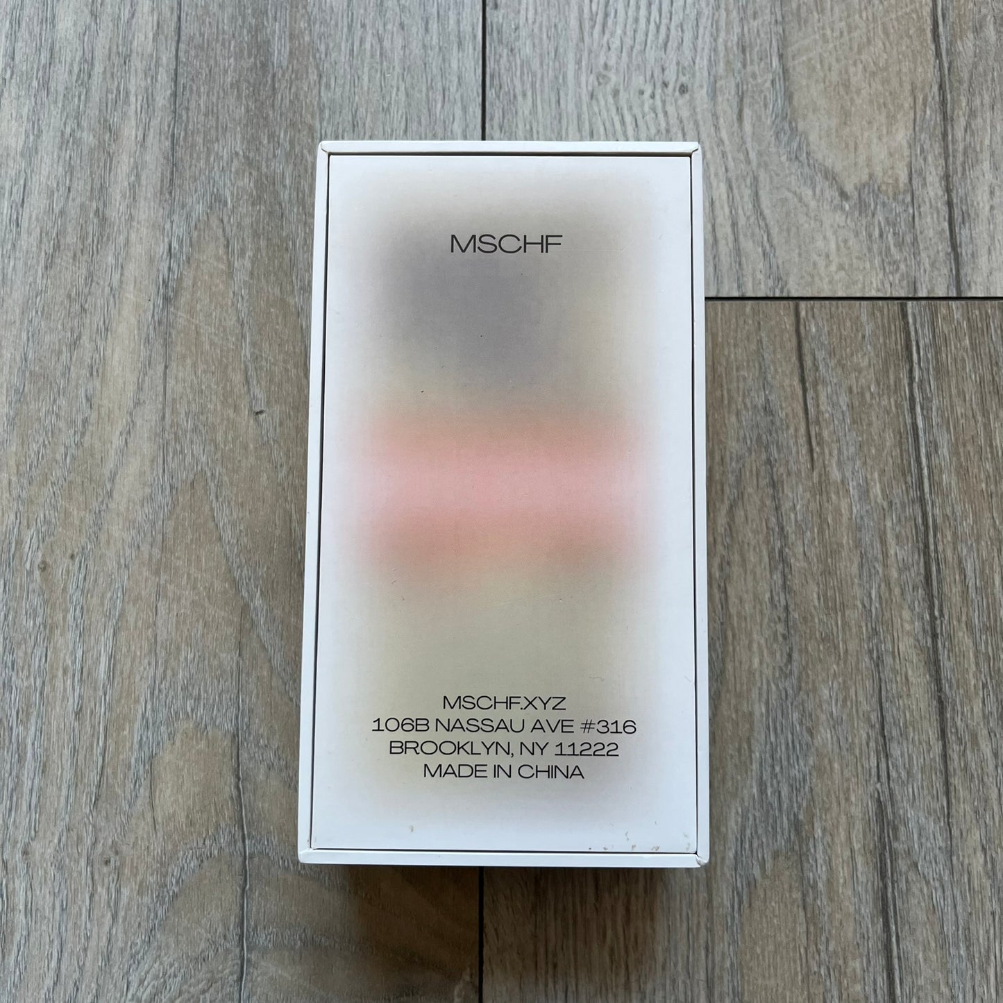 MSCHF Blur ¥5,000 Yen Figure released in October 2023. The collectible object is designed as a stack of ¥5,000 Japanese yen banknotes with a blurred sculptural effect across the entire surface. The piece recreates the appearance of a money stack while distorting the printed details, giving it a block-like form resembling a stylized or game-like currency bundle.