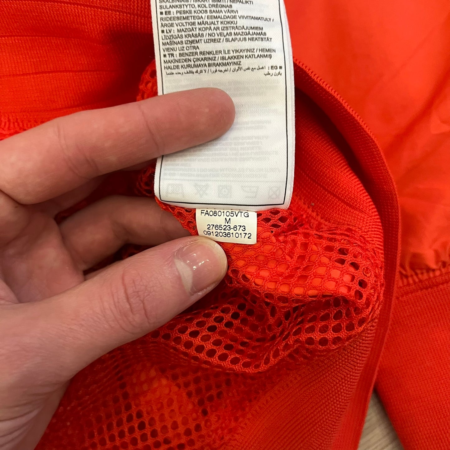 Nike Spain Olympics 2008 Split Windbreaker designed by Jarrett Reynolds. Features a red and yellow base with Spain Coat of arms and Nike black embroidered logo on the front. Dual zippers allow the jacket to be split in half and combined with other pieces from the collection, with a subtle Spain flags inside the pocket.