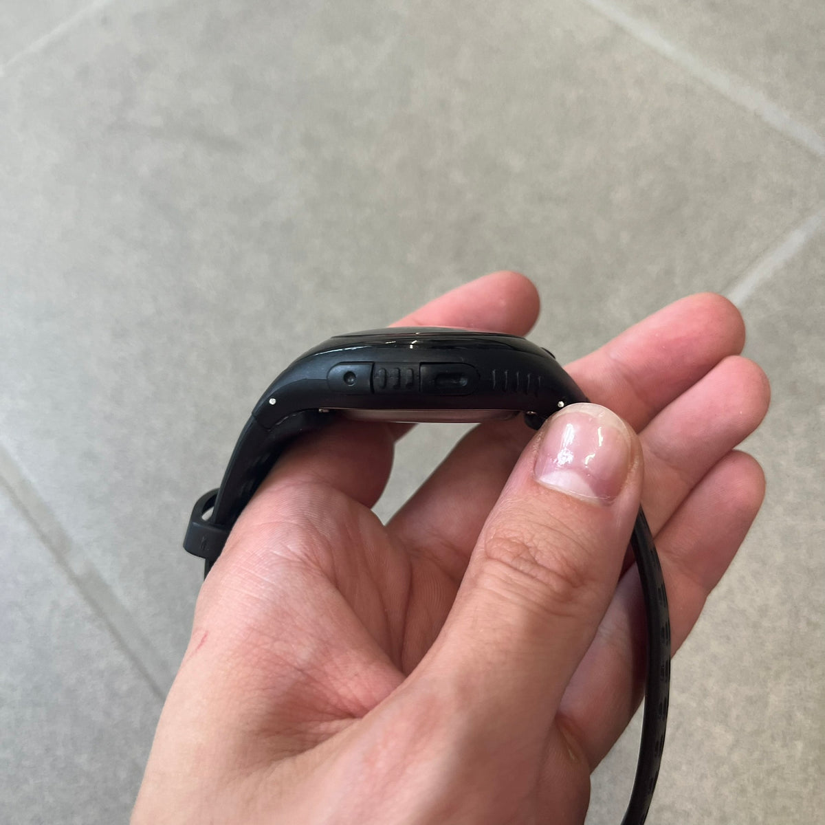 Nike Triax 2000's Bowerman Black Speed 100 Digital Watch features an all-black construction with rubber straps and a black digital display with light numerals. The case has a small Nike Swoosh at the top, while the watch includes 100-lap memory, multiple modes, and 100m water resistance.