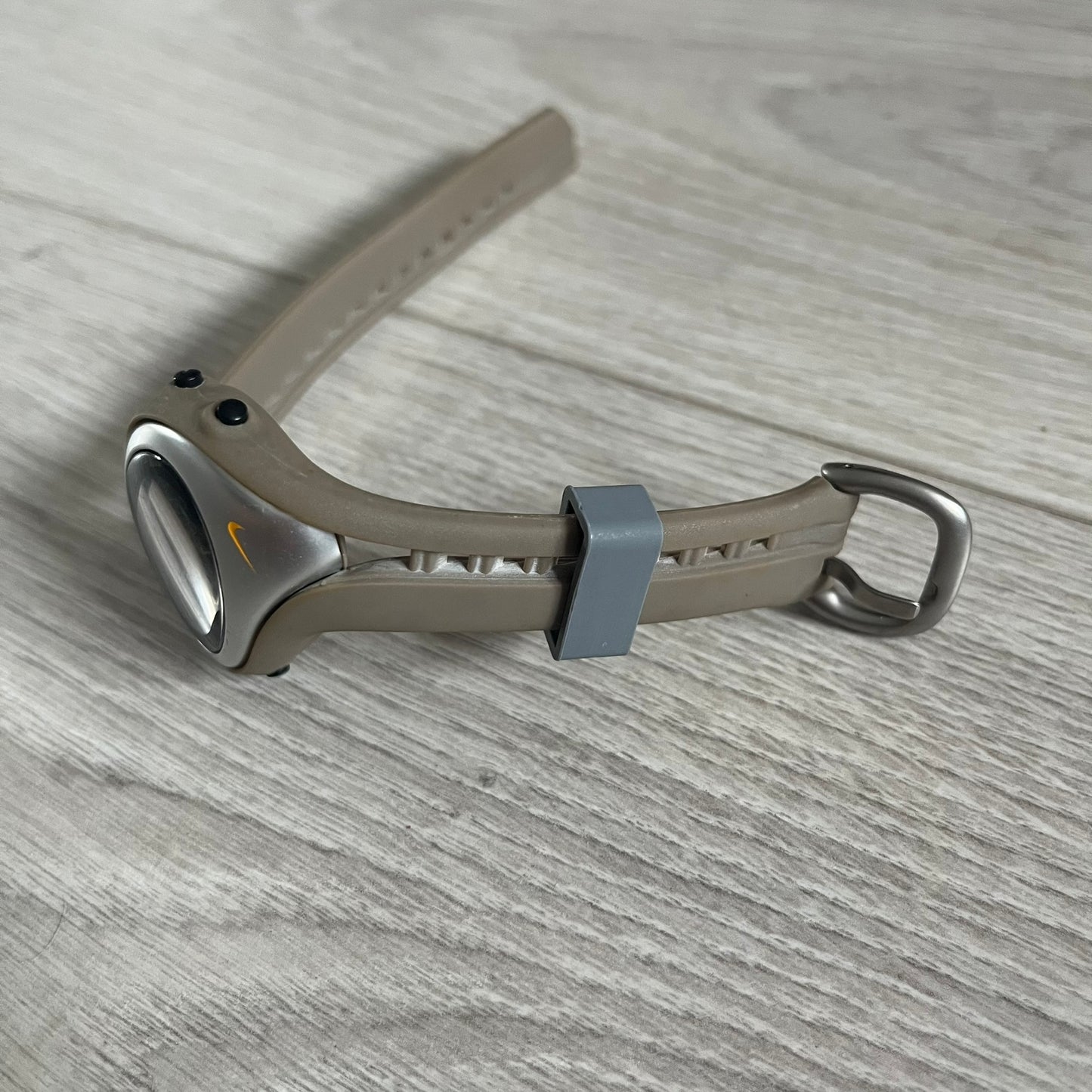Metallic tool on a wooden surface