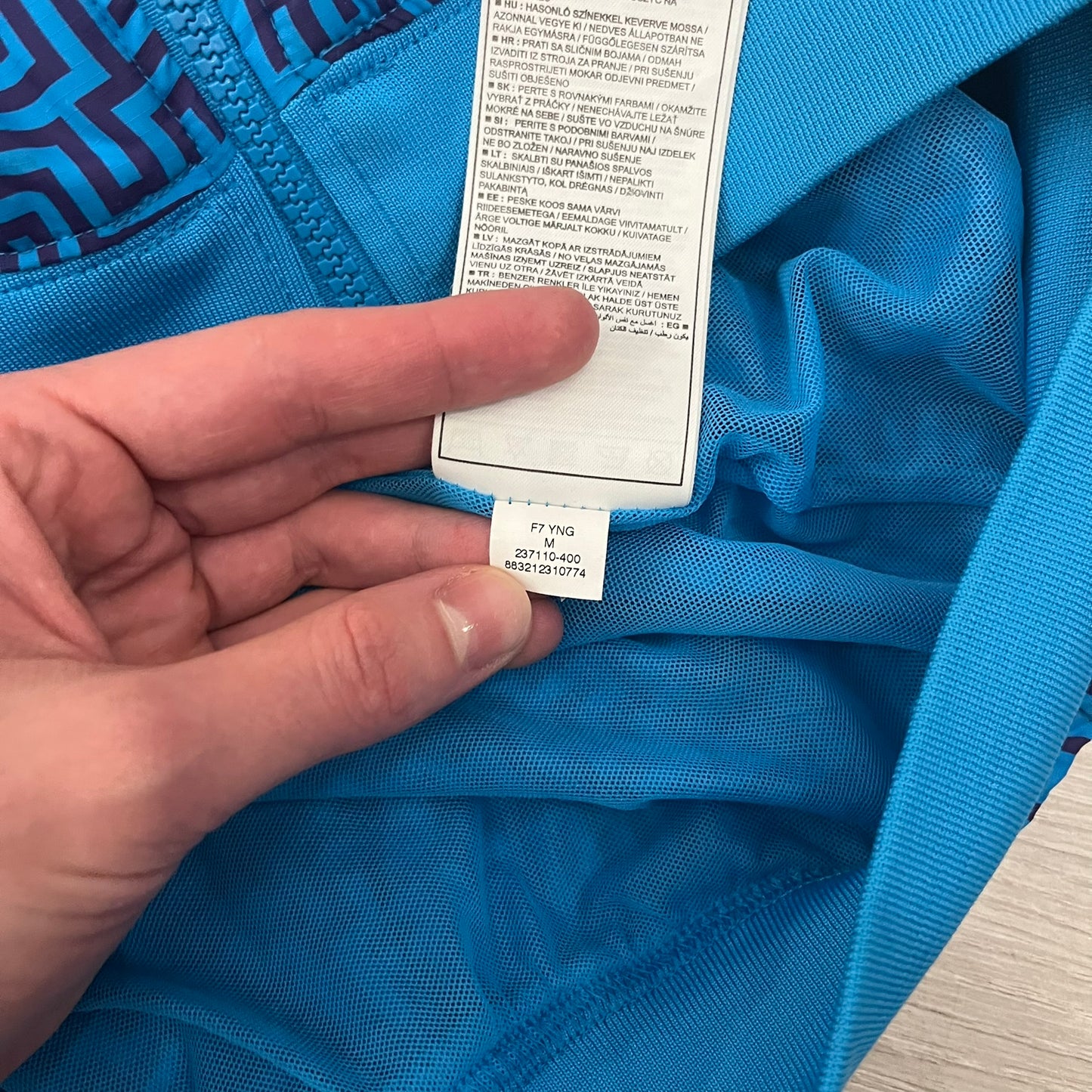 The Nike x Wood Wood “Labyrinth” Split Windbreaker (237110-400) features a full laser blue polyester body with an all-over navy labyrinth print. Designed in Copenhagen, the jacket includes zippers on the front and back allowing it to merge with other compatible models, an embroidered Nike logo and a subtle Wood Wood tag. Inside, a unique printed message from the Wood Wood founders references the jacket’s “Labyrinth” inspiration.