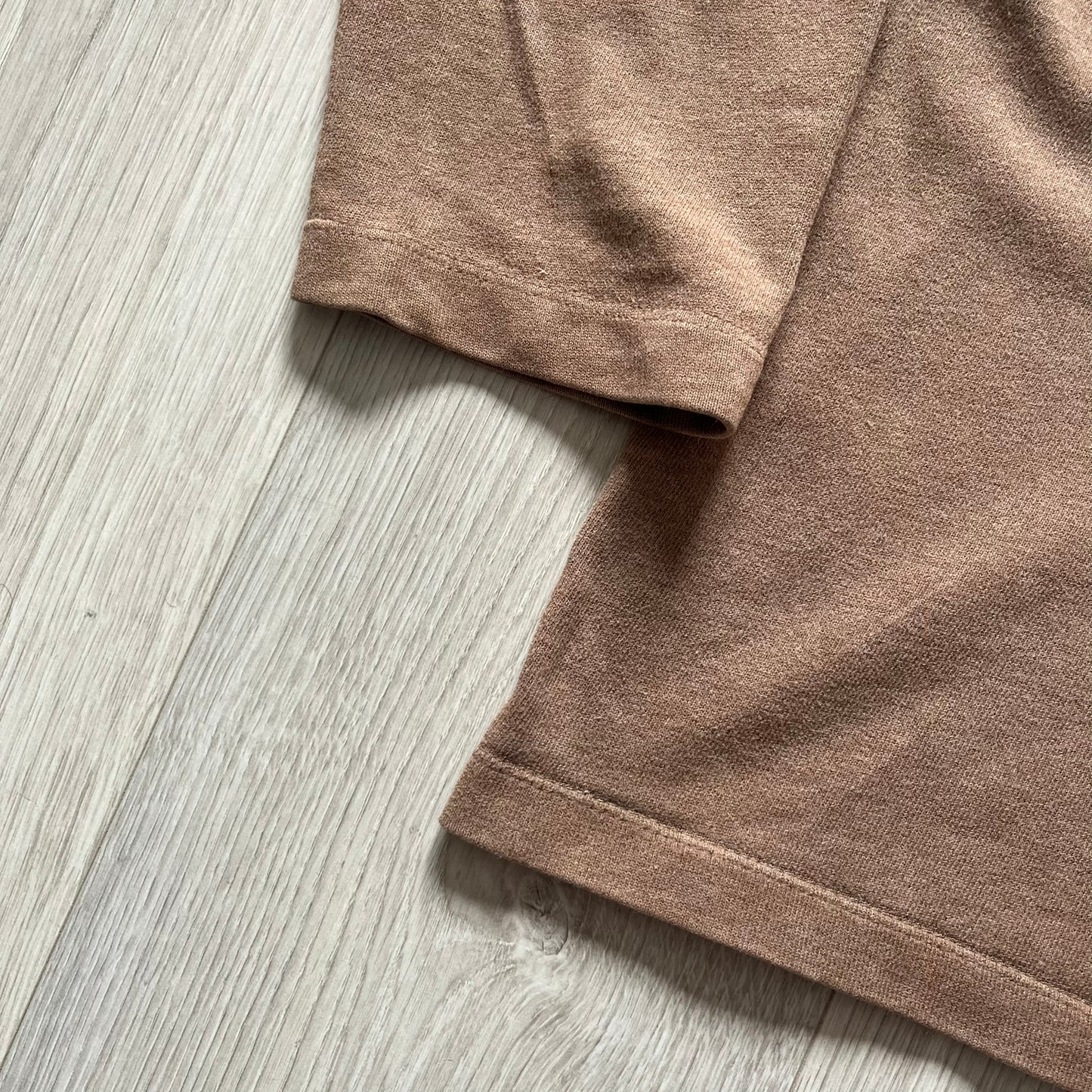 Vintage 90’s Porn Star Clothing longsleeve in brown, featuring a bold pink logo on the chest with a silhouette outline of a woman between the words “Porn” and “Star.” Crafted with quality construction, it carries the brand’s signature edgy aesthetic. Finished with a playful “must be 18 or over” detail on the tag, this rare piece embodies 90’s streetwear provocative style.