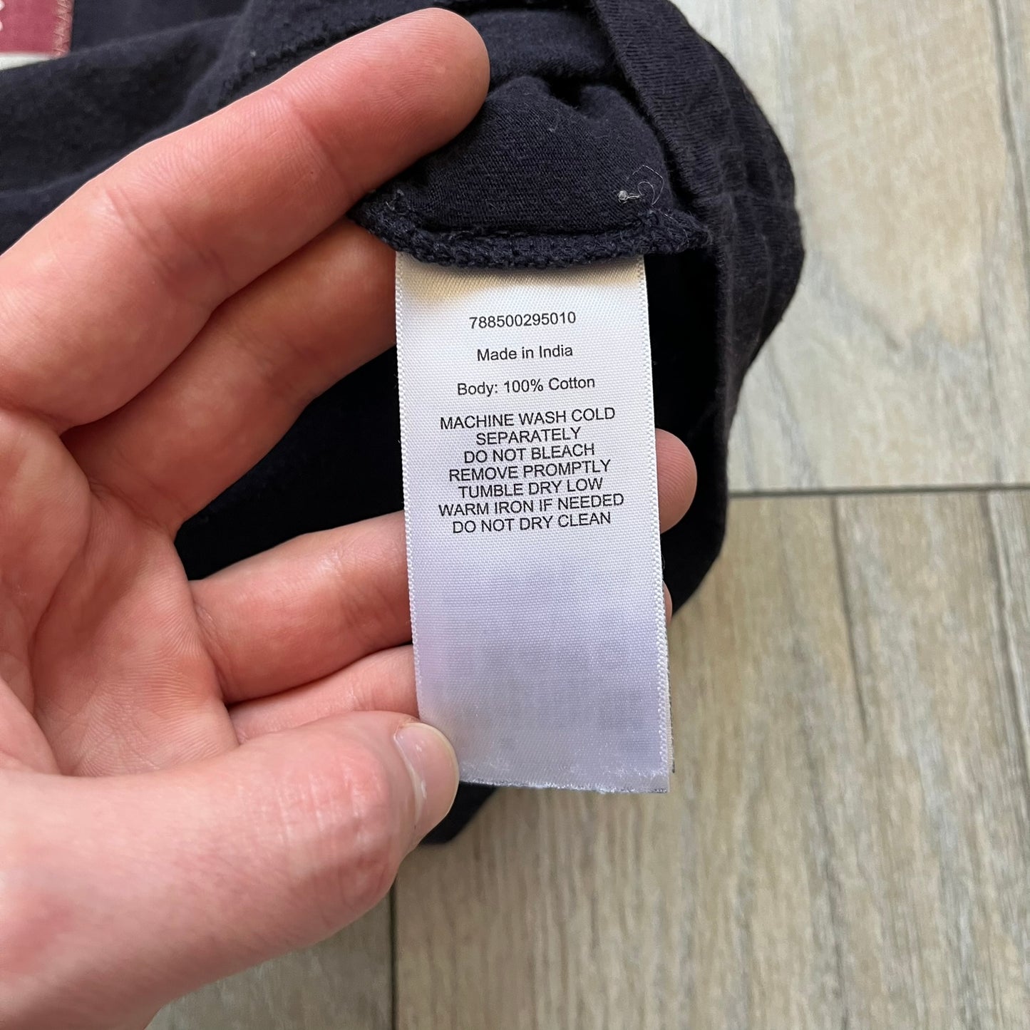 Ralph Lauren 2000s USA Bandana Flag Tee is a navy short-sleeve T-shirt made from 100% cotton. The front features a large USA flag constructed from fabric with a white bandana-style pattern, sewn onto the shirt for a raised effect. This piece comes from the Ralph Lauren Denim & Supply line.