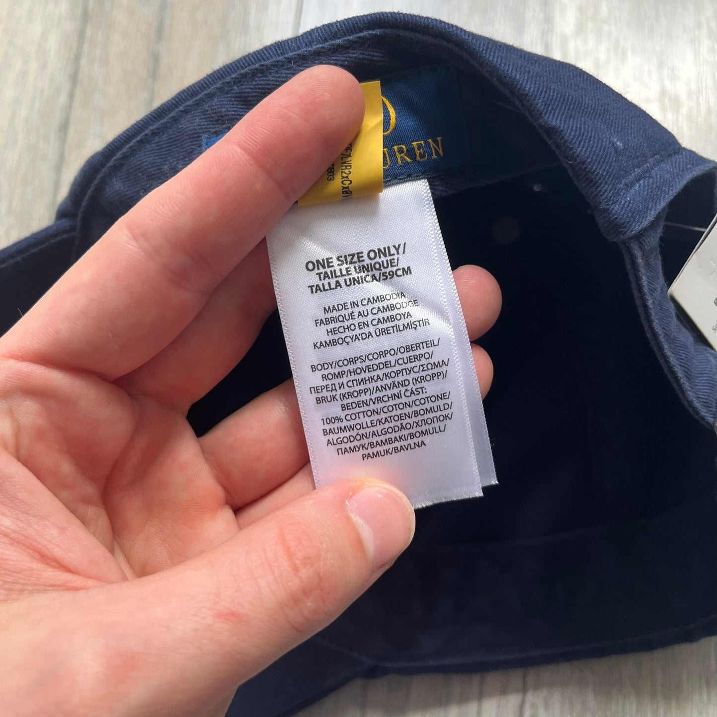 Ralph Lauren x Fortnite Navy Logo Baseball Cap is a navy cotton cap featuring bold embroidered branding on the front, including red Polo Ralph Lauren text and a Fortnite logo patch combined with a USA Ralph Lauren crest. The back includes a white embroidered Ralph Lauren logo and an adjustable strap for a custom fit.