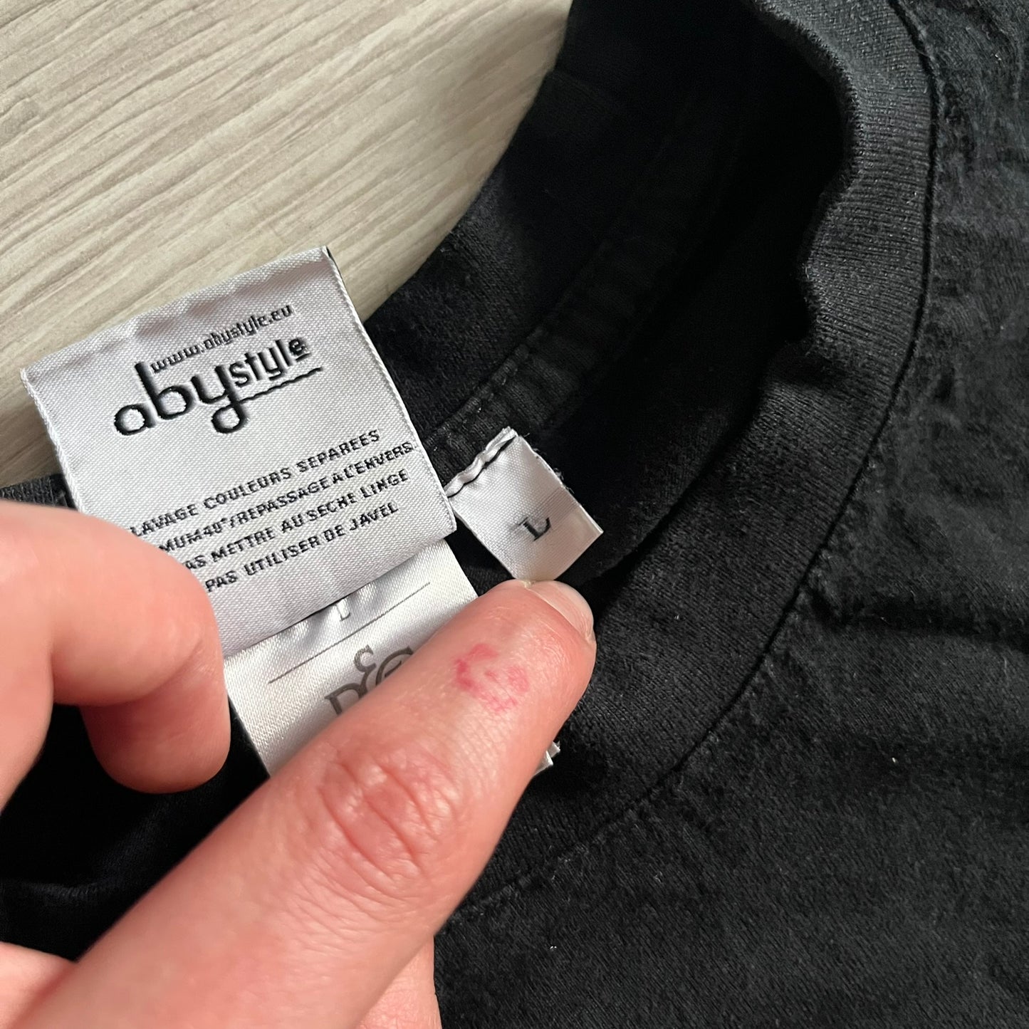 Raving Rabbids - known as “Lapins Crétins” in France - 2010 Tee in black, features a white Rabbid head inside a red circle with a slash, similar to a forbidden symbol. Officially licensed by Ubisoft, it comes with branding tags for collector and fan authenticity. 