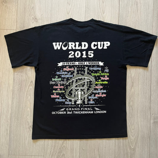 2015 Rugby World Cup tee featuring a front print with a world map, all participating countries, and “2015 World Cup” text. The back displays the date and location of the grand final along with the text “20 teams – only 1 winner.” An official commemorative piece from the 2015 tournament.