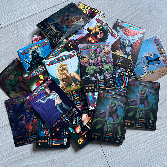 Spider-Man Heroes & Villains 2008 Card Set includes 71 standard cards and 12 foil cards, stored in a collectible metal box. Originally sold with the Spider-Man Heroes & Villains Collection magazine, these cards can be collected or used to play multiple official games.