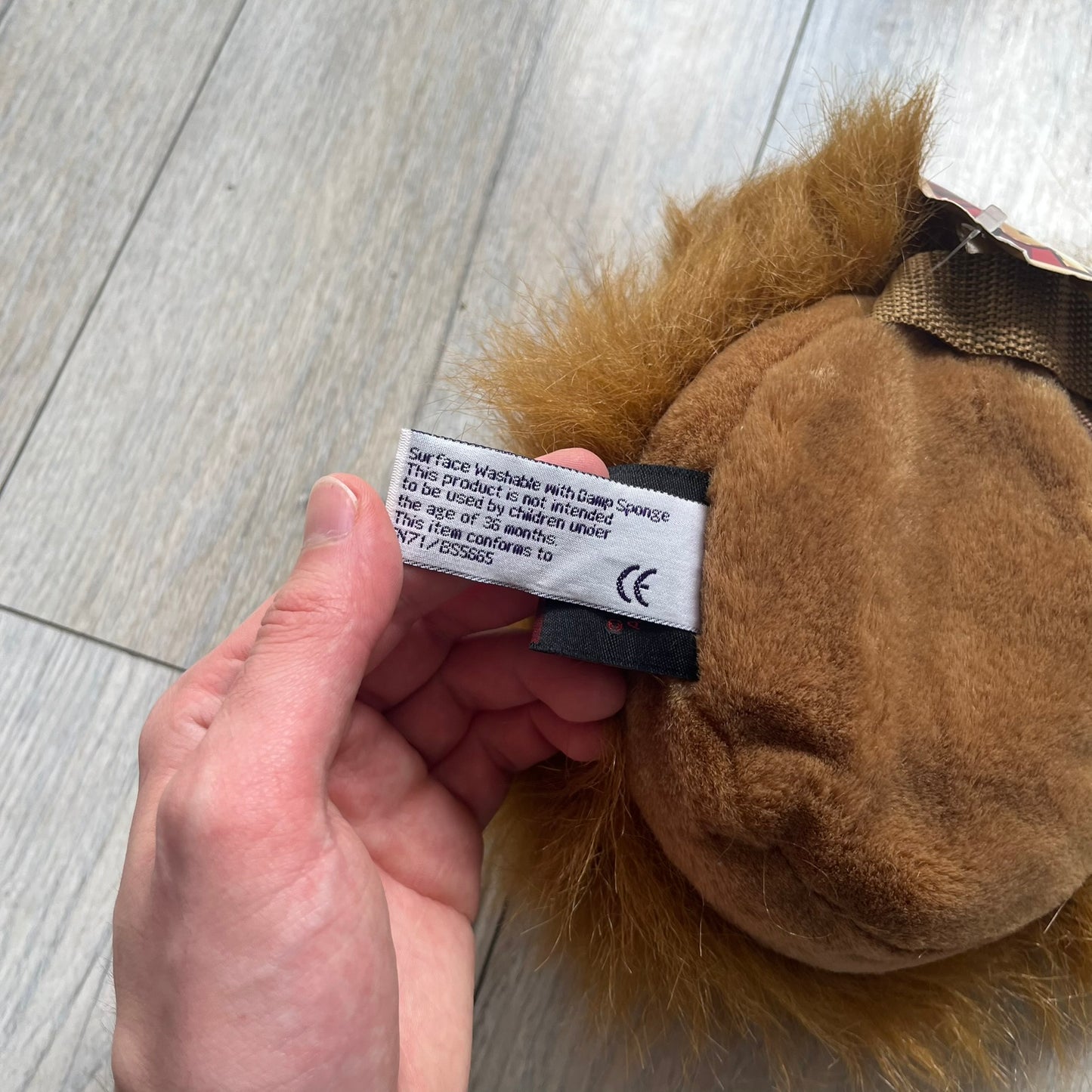 Star Wars 1990s Chewbacca Head Shoulder Bag is a novelty shoulder bag designed in the shape of Chewbacca’s head. The exterior features a furry construction with plastic eyes and a leather-like nose and mouth. It includes an adjustable shoulder strap, a single main compartment, a red Star Wars licensed tag, and the original paper tag.
