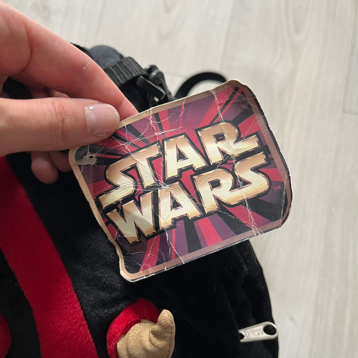 Star Wars 90's Darth Maul Head Backpack - a plush backpack shaped like Darth Maul’s head with striking red-and-black detailing and realistic plastic eyes. Features a small zip compartment on the back and adjustable straps, perfect as a collectible or standout accessory.