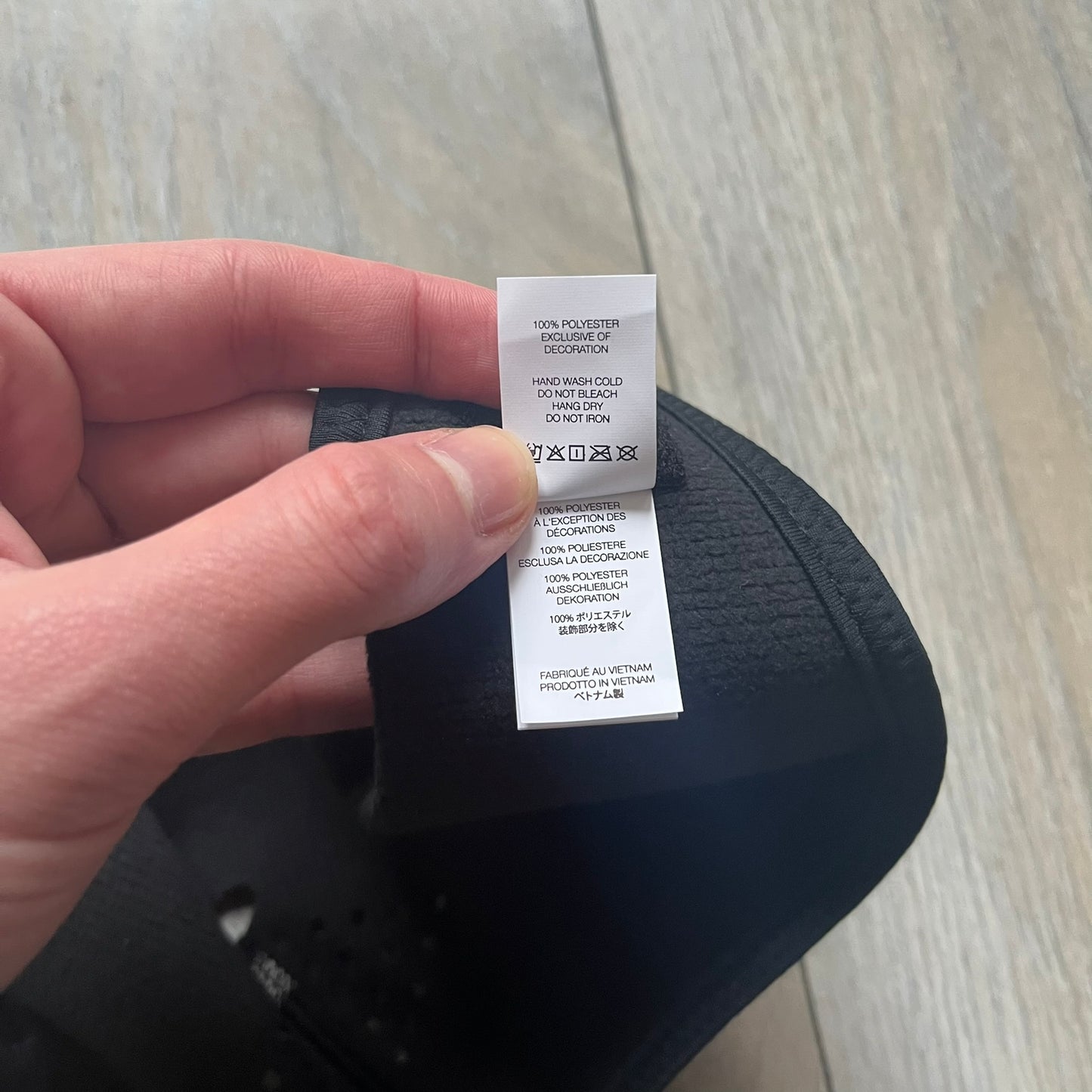 Supreme FW25 facemask produced in collaboration with GORE WINDSTOPPER® Labs, released on January 2, 2026. Constructed from water-resistant, windproof WINDSTOPPER® fabric with a fleece-bonded backing, designed for breathability and skin comfort. Features a Velcro flap closure, small front breathing perforations, nose and eye openings, a large white Supreme logo printed across the front, 3M reflective Supreme branding on the front and side, and a WINDSTOPPER® logo on the side. Finished in black.