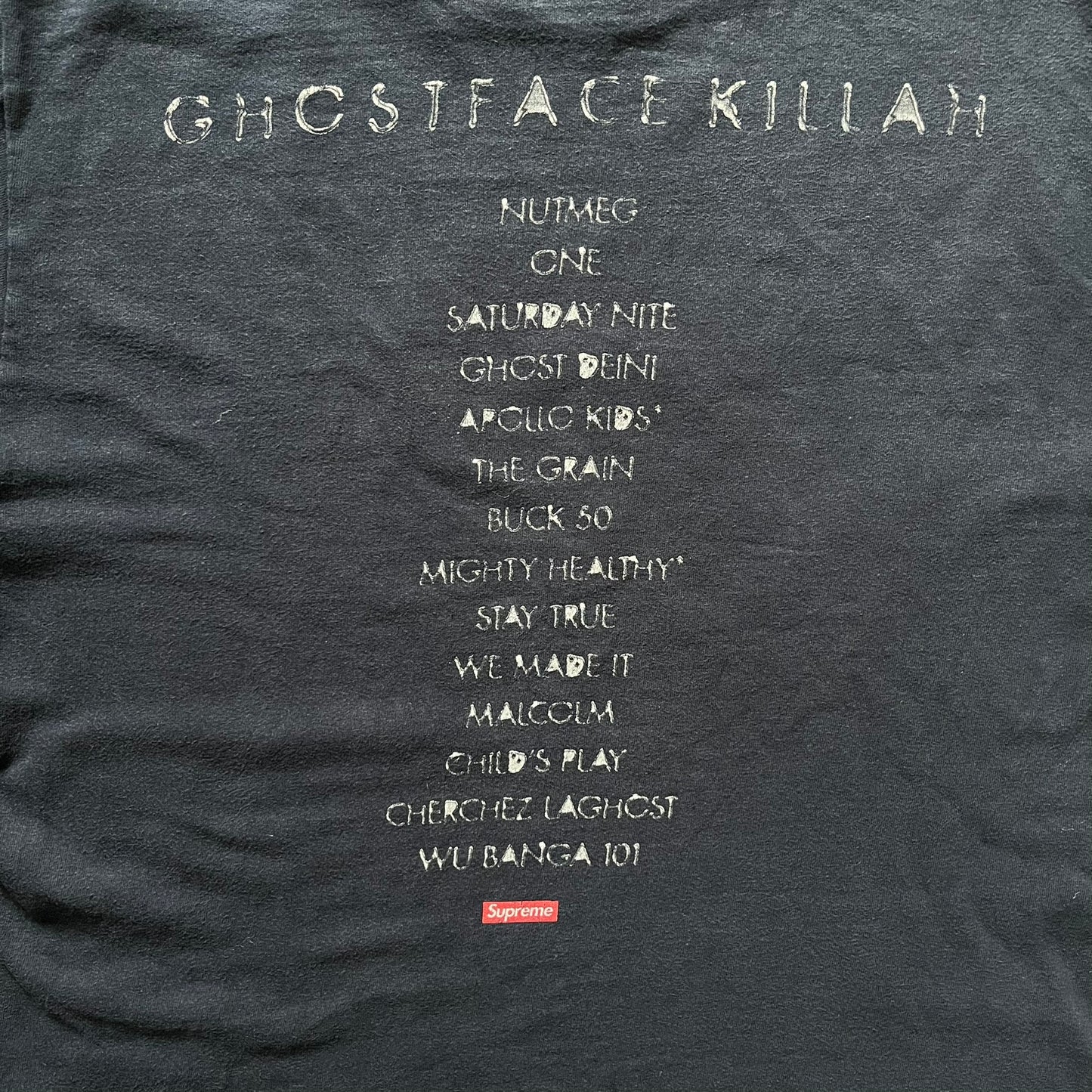 Supreme Clientele FW20 Navy Tee released in October 2020 as part of Supreme’s Fall/Winter 2020 collection. This cotton tee pays tribute to Ghostface Killah’s 2000 album Supreme Clientele, featuring the album’s iconic title graphic on the front and full tracklist on the back. A standout Supreme graphic tee that merges streetwear with hip-hop history.