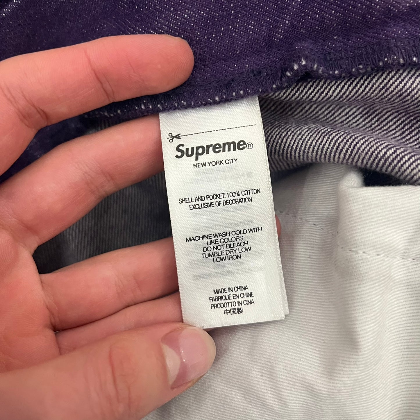 Supreme Denim Purple SS25 Baggy Shorts crafted from 13 oz. all-cotton denim in a purple hue. Features a relaxed baggy fit, classic five-pocket styling, zip fly, copper oxide rivets, and embroidered Supreme New York logo on the back pocket. Durable, stylish, and perfect for everyday streetwear.
