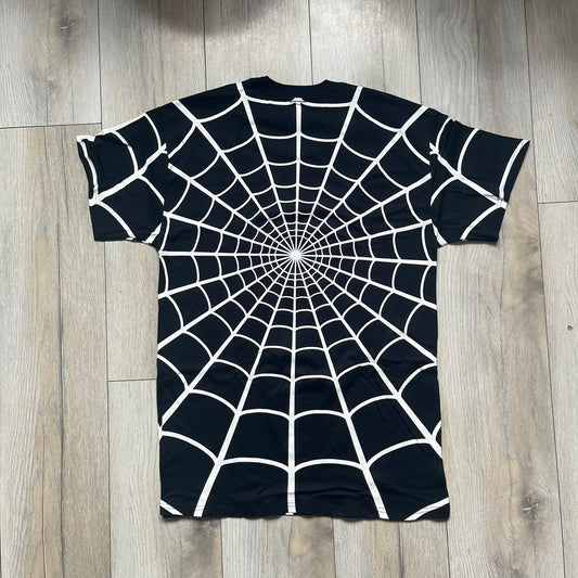 Supreme Hanes SS26 Spider-Man Black Tagless Tee is a black all-cotton crewneck T-shirt from the Spring/Summer 2026 collection, produced on a Hanes tagless blank. The shirt features an all-over white web print covering the front, back, and sleeves, with a small red Supreme stamp logo printed near the bottom corner.