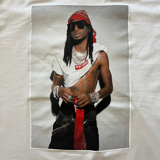 Supreme Playboi Carti photo tee in white from the FW25 collection, featuring a large front print of the influential rapper. Crafted from soft cotton, it merges Supreme’s iconic photo tee format with Carti’s distinct cultural presence.