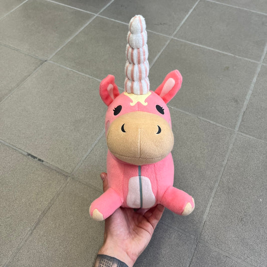 Team Fortress 2 Balloonicorn 2013 Plushie is a pink plush based on the Balloonicorn character from Pyroland, introduced in the 2012 Pyromania update. Released by Valve in 2013 as part of the first series of Valve-themed plush toys, it measures approximately 14.5 inches from horn tip to tail. This plush comes without the original in-game item code.