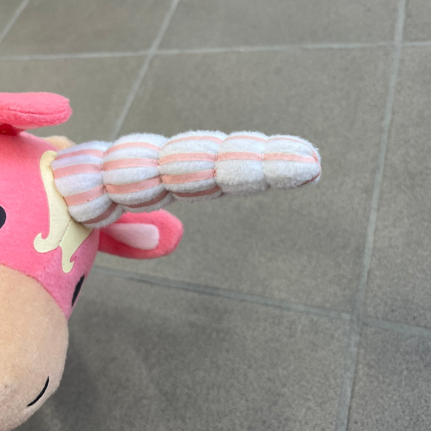 Team Fortress 2 Balloonicorn 2013 Plushie is a pink plush based on the Balloonicorn character from Pyroland, introduced in the 2012 Pyromania update. Released by Valve in 2013 as part of the first series of Valve-themed plush toys, it measures approximately 14.5 inches from horn tip to tail. This plush comes without the original in-game item code.