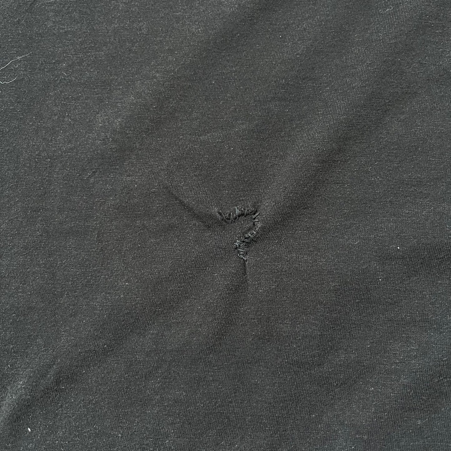 Tomb Raider Lara Croft 2006 Legend Tee is a black V-neck T-shirt made from 100% cotton on a Hanes blank. The front features the Lara Croft: Tomb Raider Legend cover graphic with Lara Croft’s face and the game title printed below. A white Eidos logo is printed on the sleeve, referencing the official game publisher.