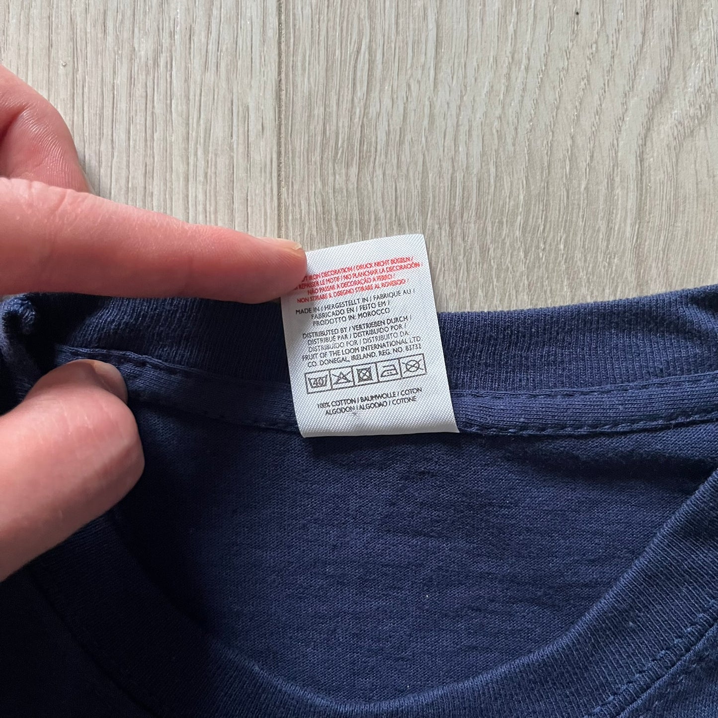 WWE John Cena “Hustle Loyalty Respect” Tee in navy, printed on a classic Screen Stars blank. Features a large front graphic of John Cena with big red, white, and blue lettering behind / in front of him and the WWE logo beside. A staple piece from Cena’s prime wrestling era.