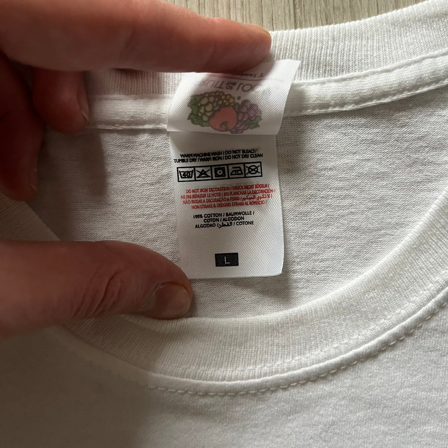 Vintage WWE Superstars Tee in white, highlighted by a large front print of wrestling icons The Rock, Rey Mysterio, and John Cena over a yellow base. Features the WWE logo and “Superstars” branding, printed on a Fruit of the Loom blank.