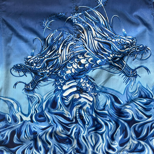 Blue shirt with a detailed dragon design on a blue background