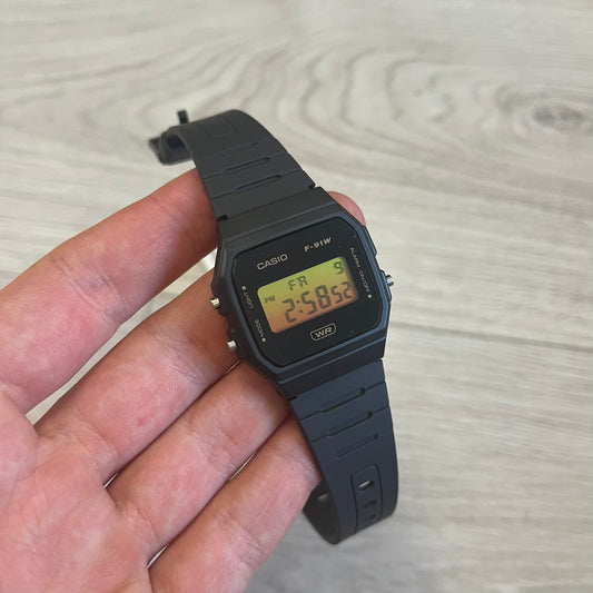 Custom Casio F-91W Black digital watch featuring a Gradient Yellow & Orange filter screen. Slim 8.5 mm profile, lightweight 21 g build and flexible bio-based resin band ensure lasting comfort. Includes alarm, stopwatch, and microlight function for everyday functionality.