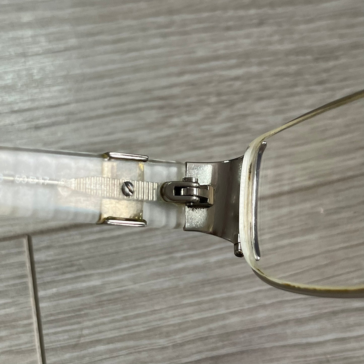 Close-up of a pair of glasses on a wooden surface