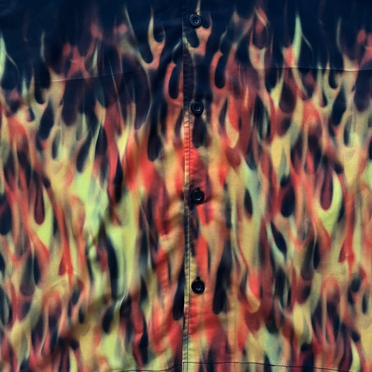 Flame patterned shirt with buttons on a dark background