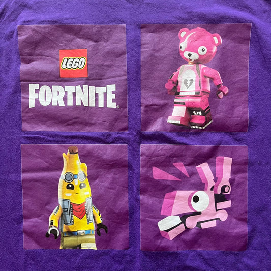 Purple fabric with LEGO Fortnite character designs on a purple background
