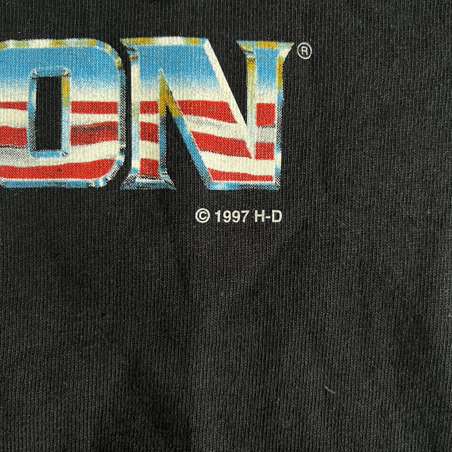 Close-up of a logo with 'H-D' on a black background