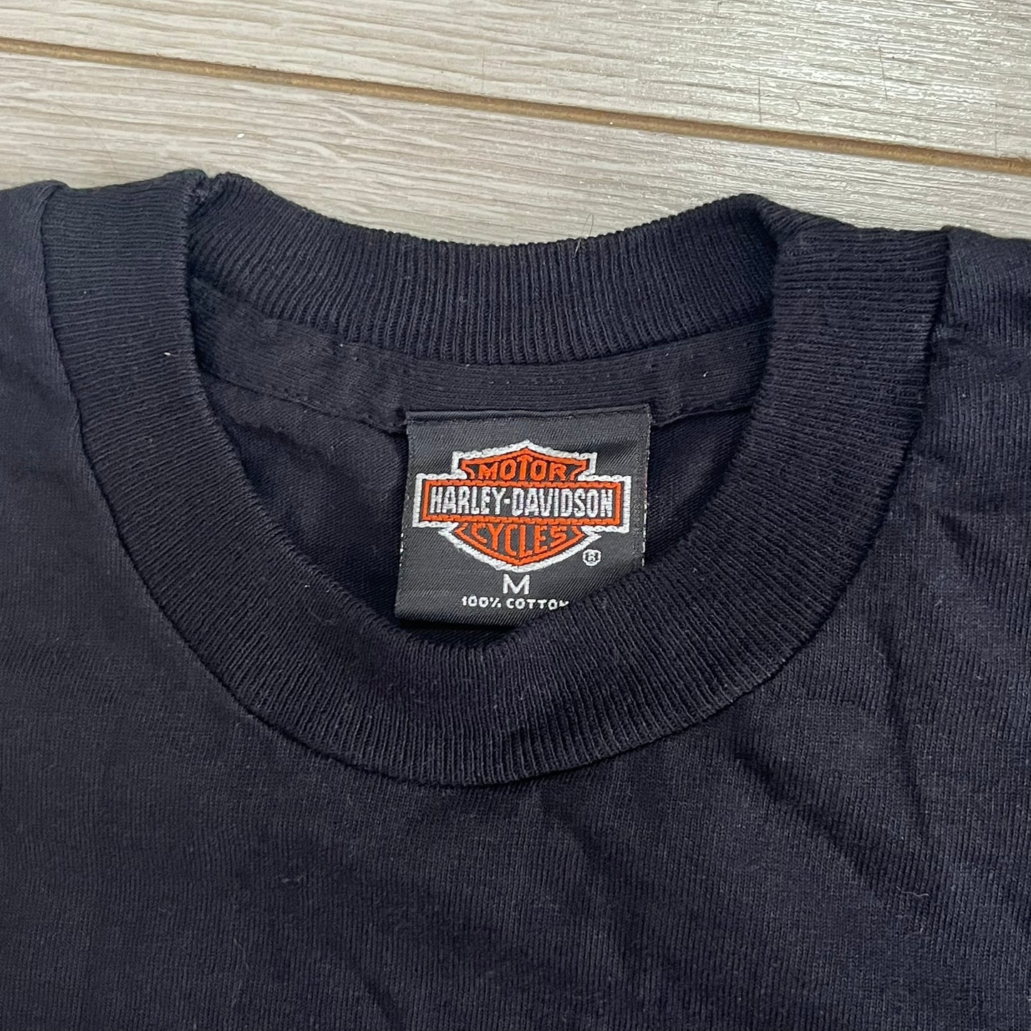 Harley Davidson logo on a black shirt collar