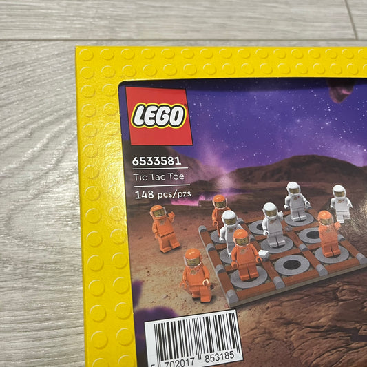 LEGO Tic Tac Toe set packaging on a wooden surface