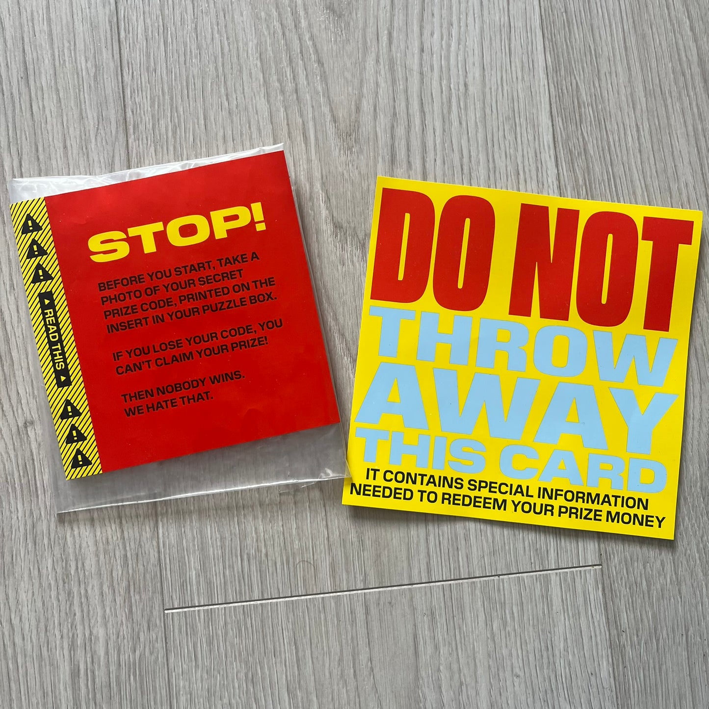 Two cards with text on a wooden surface