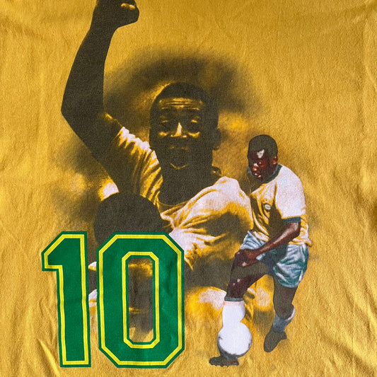 T-shirt with a graphic of a soccer player and number 10 on a yellow background