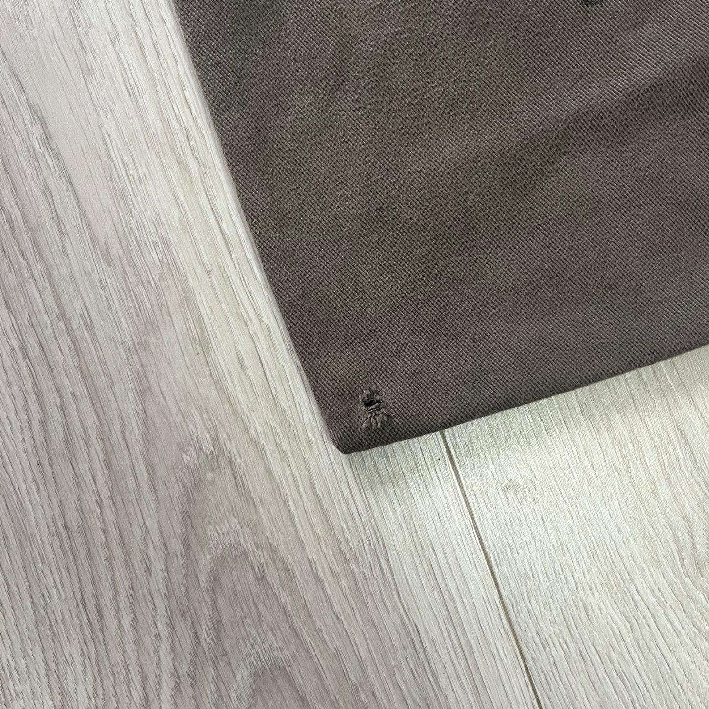 Gray mat on a light wood floor