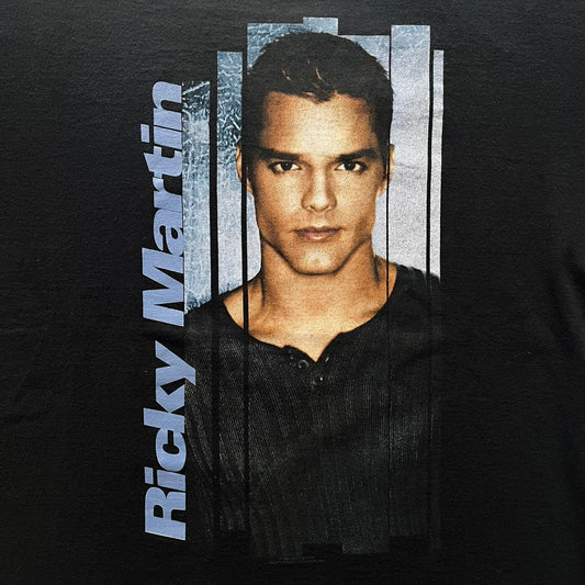Black t-shirt with a graphic of a person and 'Ricky Martin' text on a dark background