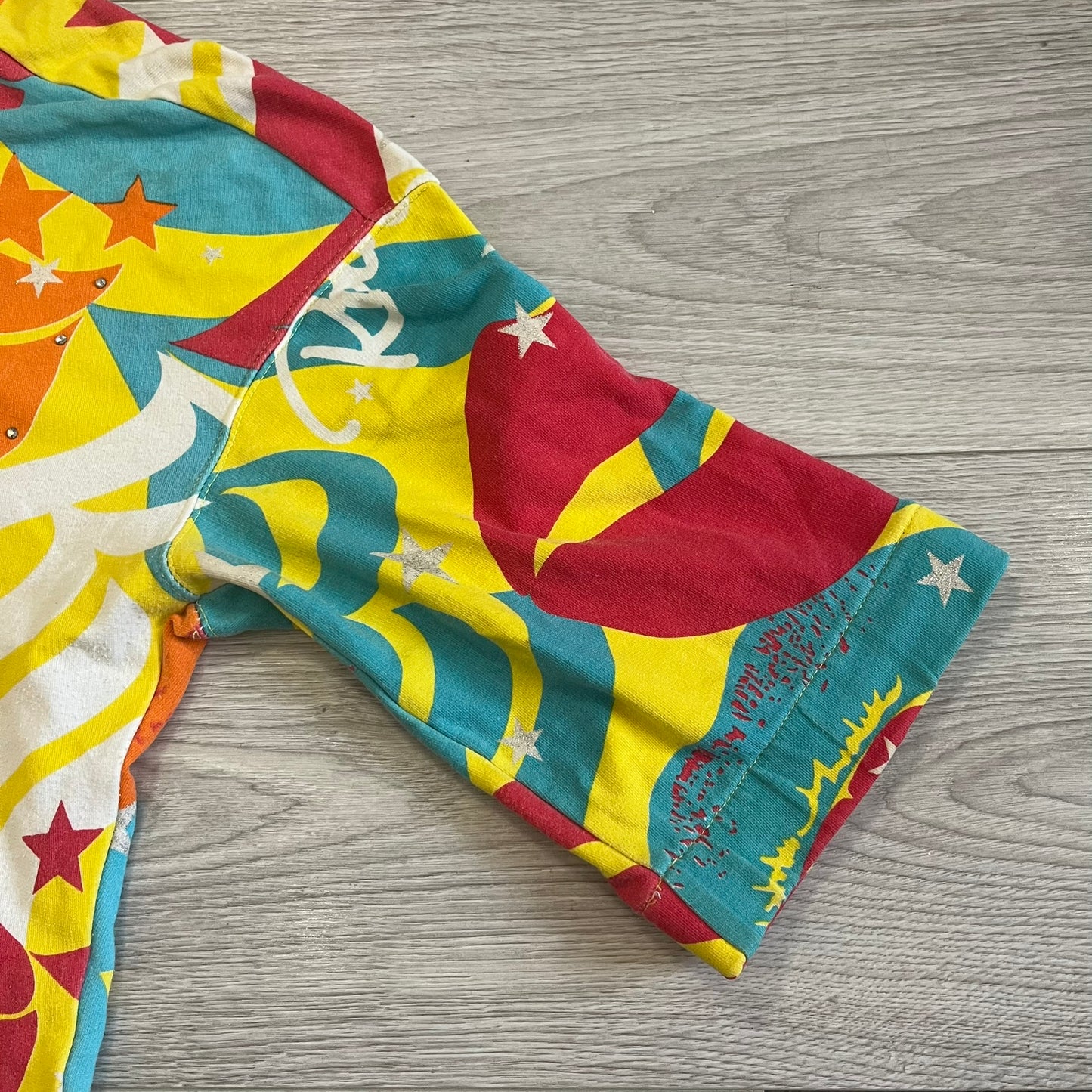 Colorful patterned fabric on a wooden surface
