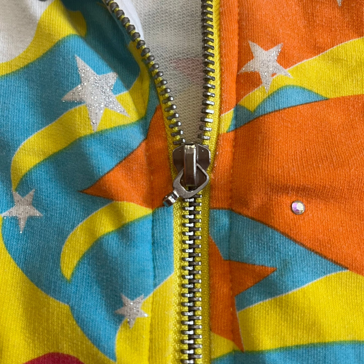 Colorful jacket with star patterns and a zipper
