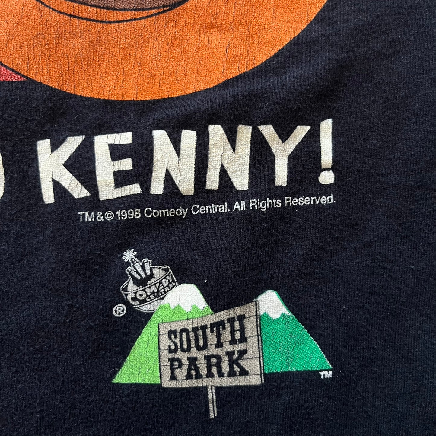Black t-shirt with 'Kenny!' text and South Park logo on a dark background