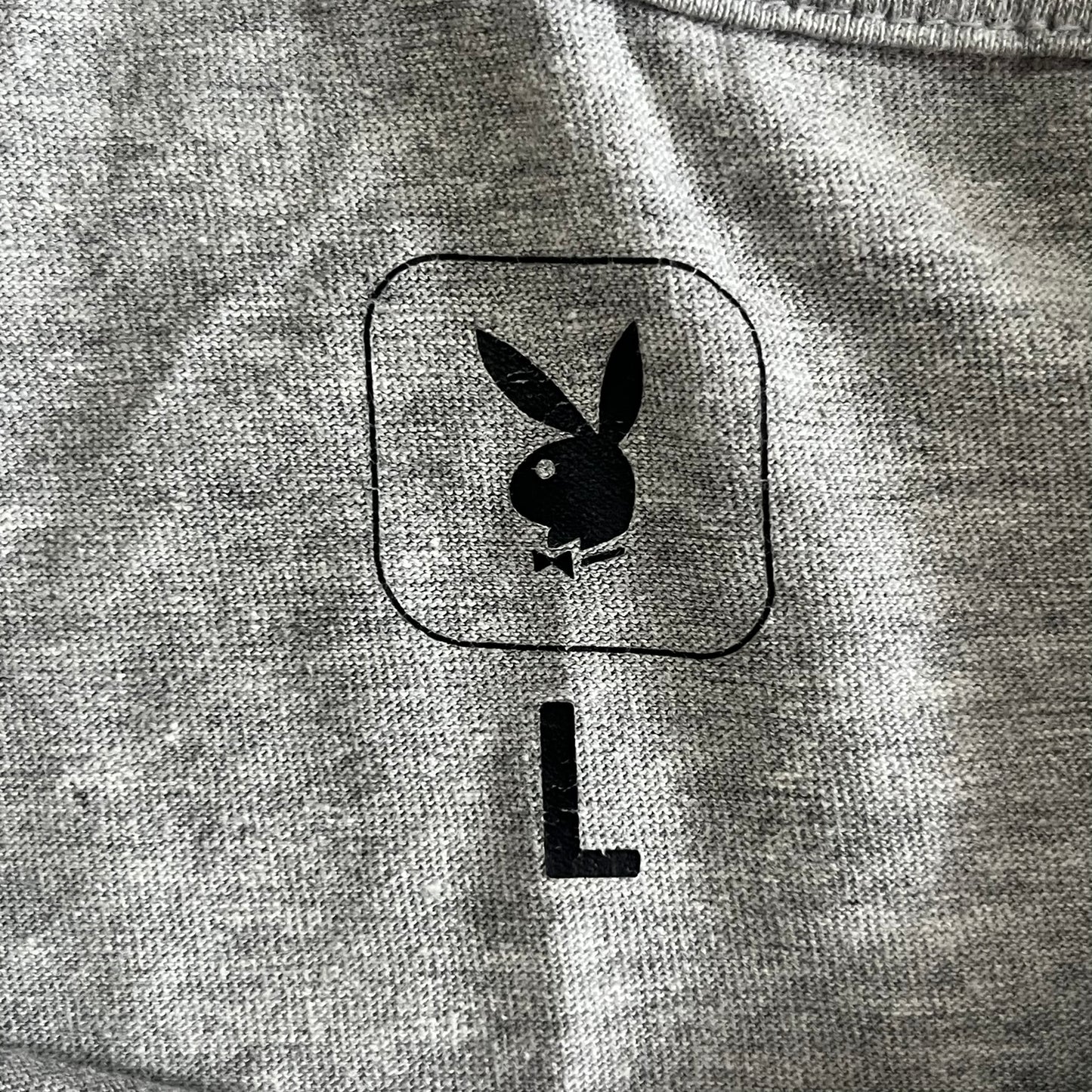 Gray sweatshirt with a black logo on a gray background