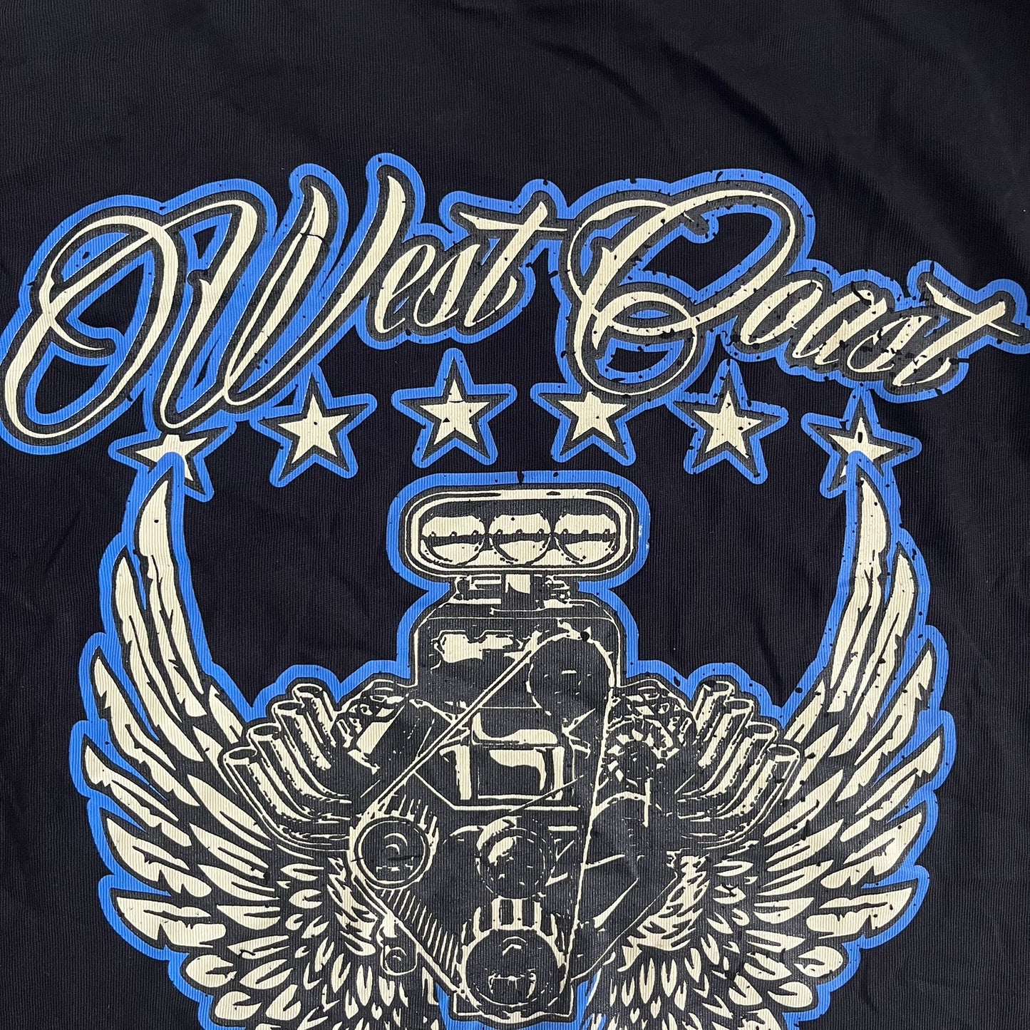 Black t-shirt with 'West Coast' design featuring a engine and wings on a dark background