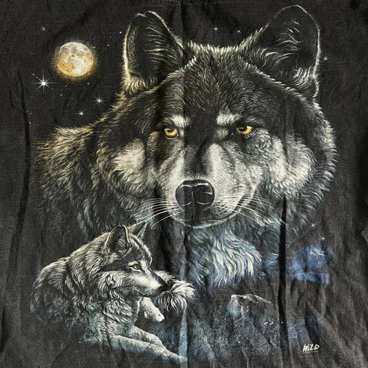 Wolf design on a black background with moon and stars