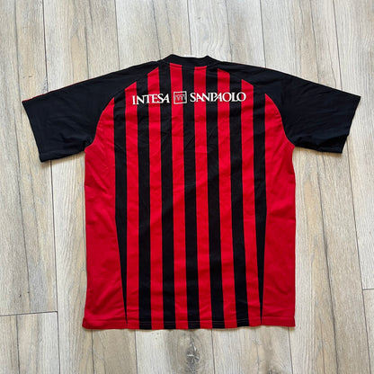 AC Milan Academy x Dolce &amp; Gabbana 2008/09 Home Tee is a black and red striped football shirt with black short sleeves. The chest features AC Milan Academy and Dolce &amp; Gabbana Junior logos on the sides, and a adidas logo in the center. Made with Clima365 technology.
