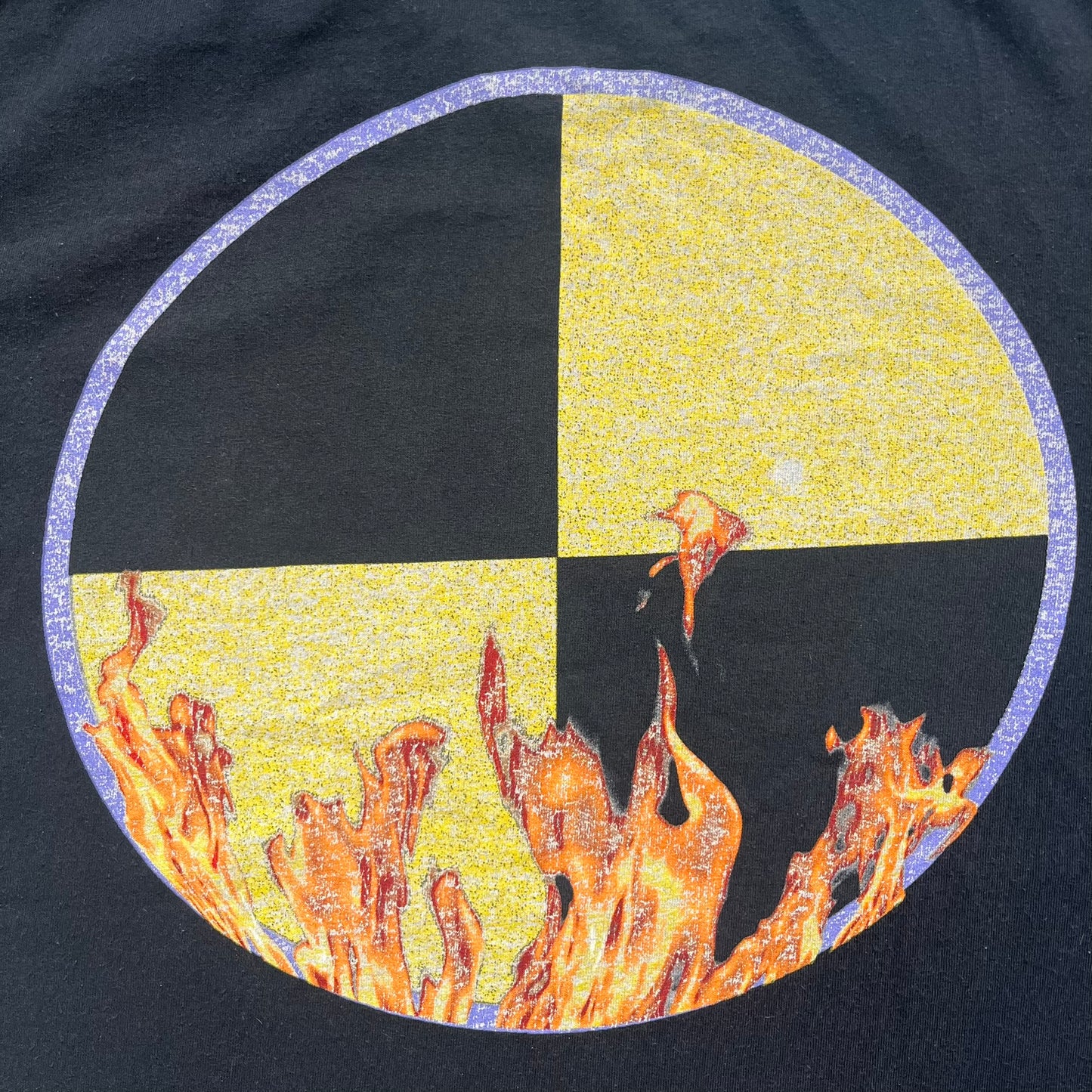 A$AP Rocky 2019 Injured Generation Tour “Crash Dummy” Tee is a black T-shirt released as part of the Injured Generation tour merchandise collection. The front features an illustrated crash dummy version of A$AP Rocky with “TESTING” text printed underneath. The opposite side includes a yellow and black burning TESTING logo graphic. Made in the USA.&nbsp;