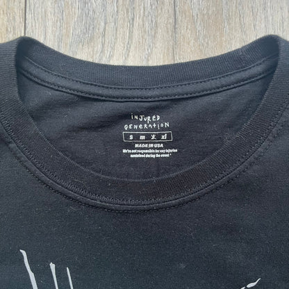 A$AP Rocky 2019 “Injured Generation” Tour “Pickpockets” Longsleeve is a black long-sleeve T-shirt released as part of the Injured Generation tour merchandise collection. The front features a large graphic of A$AP Rocky with green “Warning! Beware of Pickpockets” text. One sleeve includes “1-800-EAT-SHIT” text, while the other features a yellow and green testing-style logo. The back displays large green “Don’t Be a Dummy A$AP Rocky Europe” text layered over a white dummy mask graphic. Made in the USA.