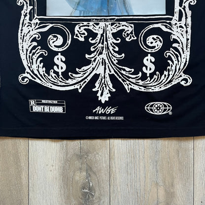 A$AP Rocky “Don’t Be Dumb” Mr Mayers Twofer Longsleeve is a limited release from the AWGE website tied to the rollout of Don’t Be Dumb by A$AP Rocky. The piece features a twofer construction with a black body and white sleeves, with a front graphic of the Mr Mayers figure in a blue trench coat with “Mr Mayers” text and small AWGE logos. The back includes a framed graphic with “Don’t Be Dumb” text, using a lenticular-style vinyl panel that shifts between the Mr Mayers figure and A$AP Rocky in the same outfit