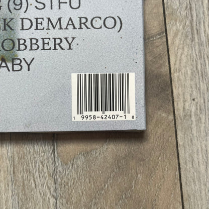 A$AP Rocky x Quince “Shirthead” Exclusive Vinyl is a limited edition 2-disc LP released alongside Don’t Be Dumb, the fourth studio album by A$AP Rocky in 2026. The vinyl was produced in collaboration with Quince as part of the “Shirthead” concept tied to the album rollout. The release includes the full album pressed across two records and was issued as a collectible edition connected to the project’s launch.