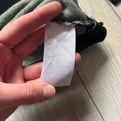 Adidas Jeremy Scott Alien Face 2012 Sweater features an all-over print of white alien faces arranged in alternating upright and upside-down patterns. The eyes of each alien are replaced with green Adidas Originals logos, creating a distinctive graphic design.