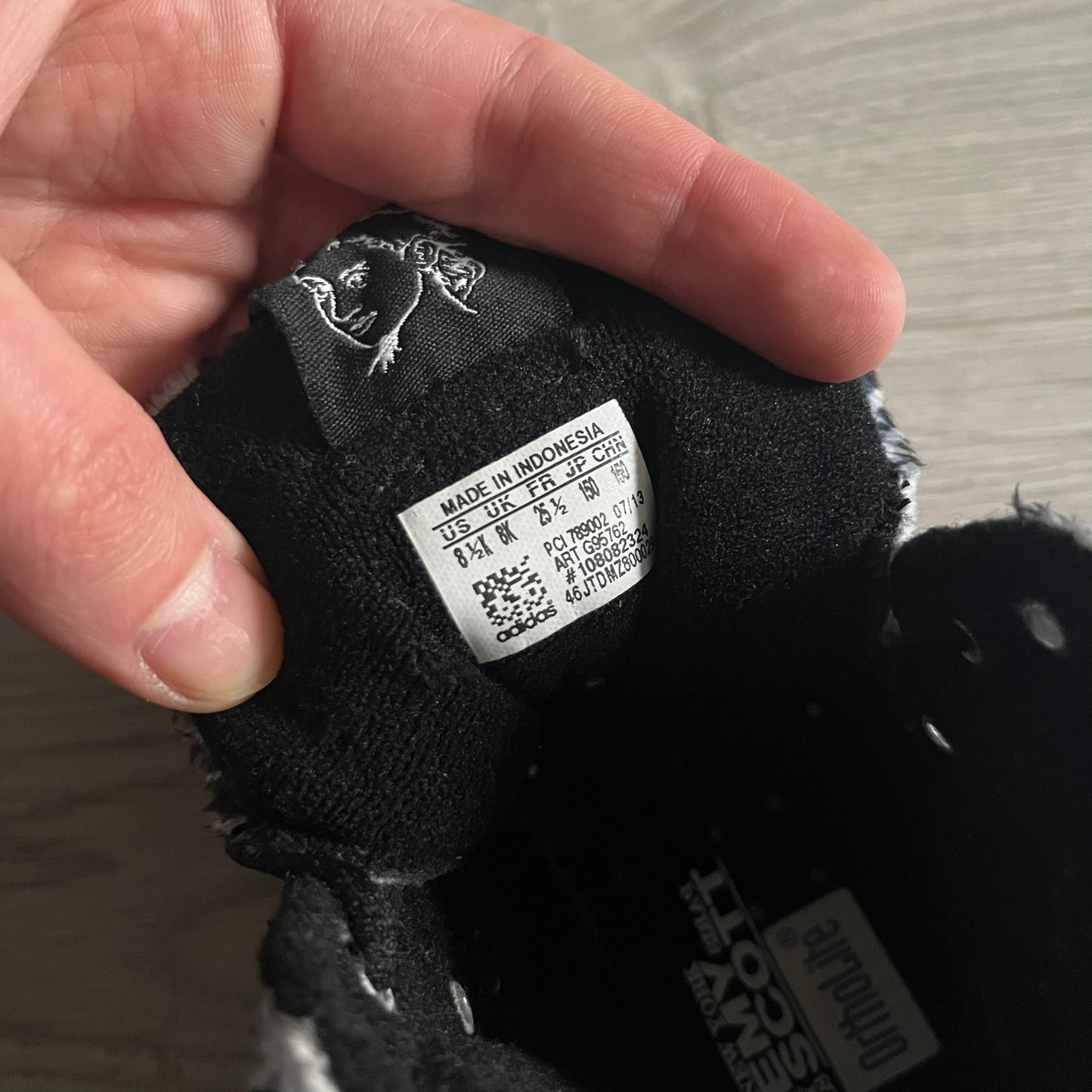 Adidas Jeremy Scott Zebra Black &amp; White Sneakers - Sample pair, Style G95749. High-top sneakers featuring black and white faux-fur zebra print, a 3D tail at the heel, rubber soles, and front lace closure. From the FW13 Jeremy Scott for Adidas collection, these iconic sneakers combine classic adidas design with signature crazy JS styling.