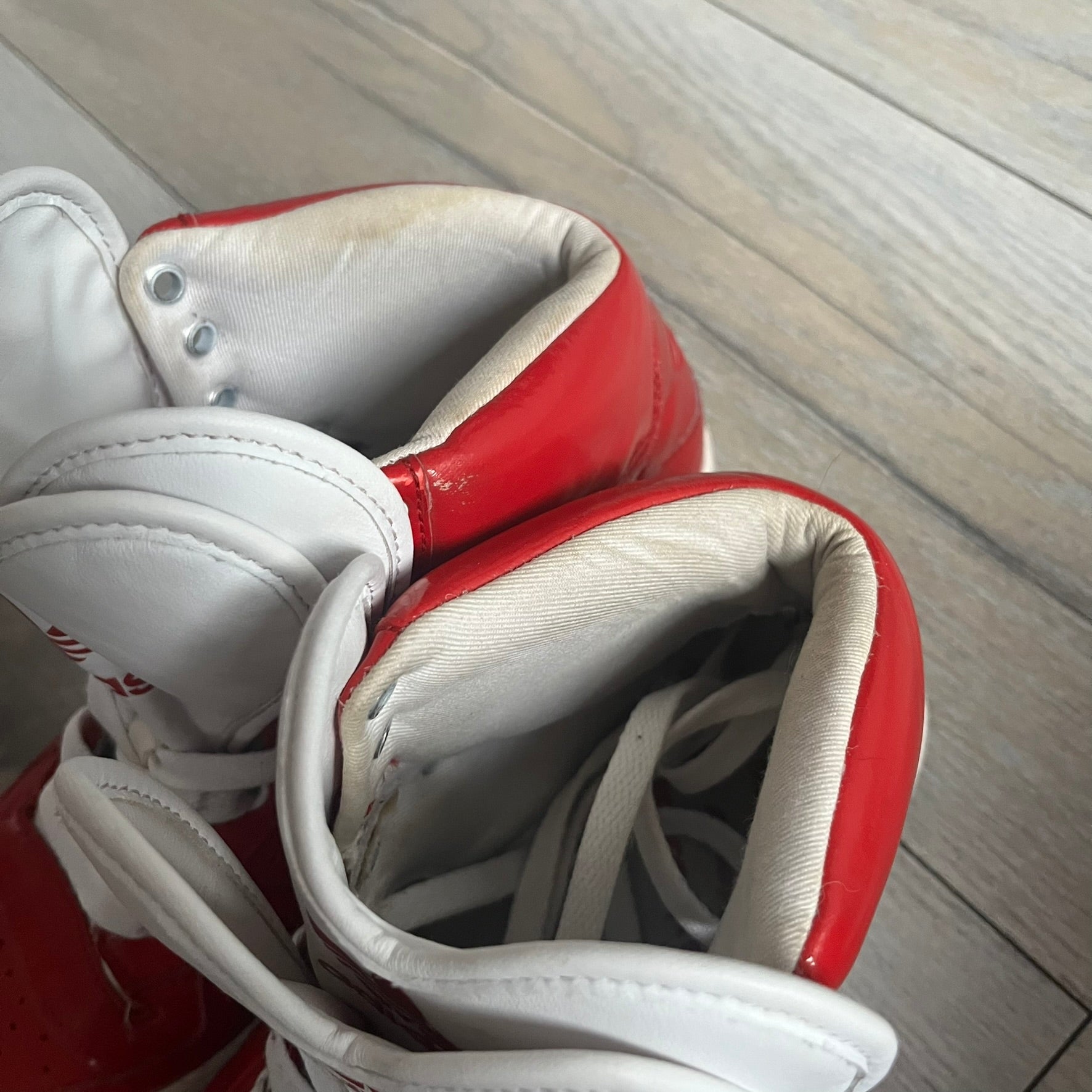 Adidas Originals Metro Attitude Logo Heart Sneakers are women’s sneakers released in 2012, featuring a red suede upper with matching University-Red accents. The design includes dual heart-shaped tongues in white with red Adidas logos, paired with a white sole and laces. Metro Attitude Logo Heart W model (G61014) inspired by Jeremy Scott collaborations.